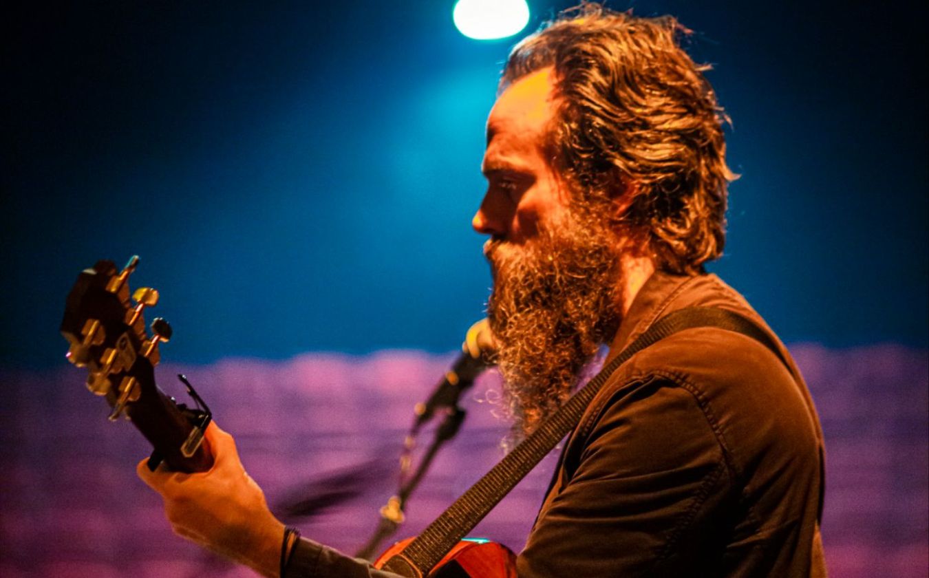 Indie-folk artist Iron & Wine with his guitar